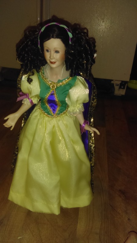 A princess doll in a yellow dress.