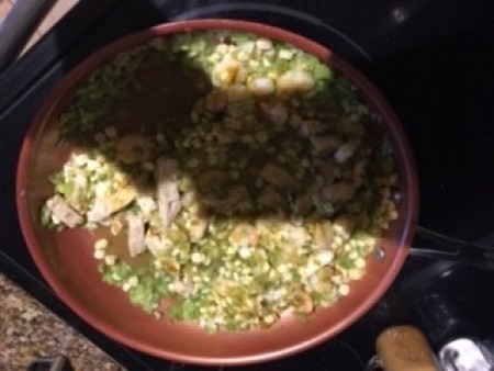 Cooking chicken and shrimp in the frying pan.