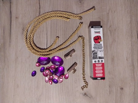 Supplies for making a decorative necklace.