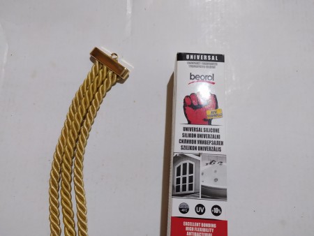 Cords attached to a clasp.