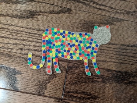 Decorating the cheetah with colorful spots.