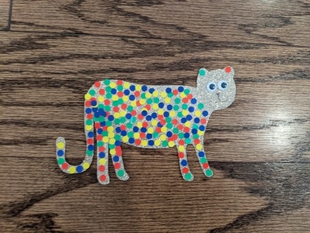 Adding a face to the cheetah shape.