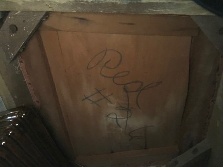 Markings on the bottom of a chair.