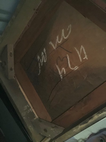 Markings on the bottom of a chair.