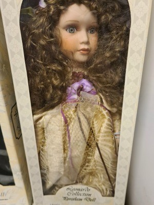 A porcelain doll in original packaging.