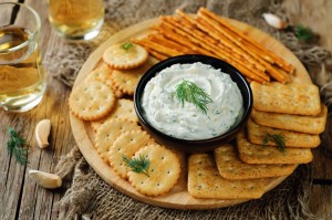 Cream cheese dip surrounded by crackers.