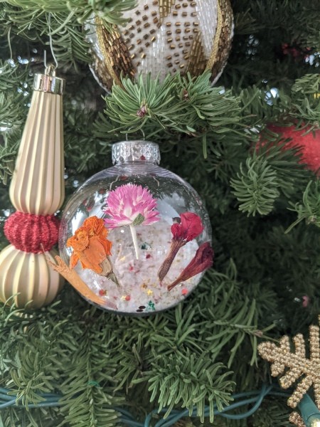 A filled ornament with decorative dried flowers.