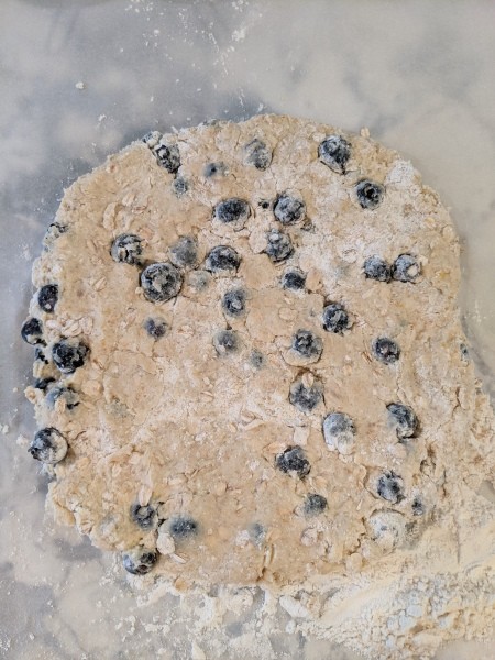 Flattening the scone mixture.