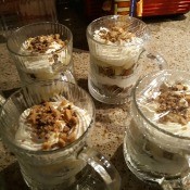 Decorative glass mugs filled with trifle.