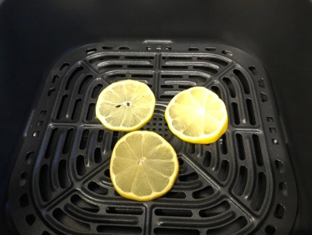 Lemon slices in an air fryer.