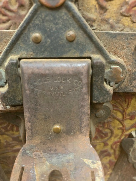 The metal lock on an old trunk.