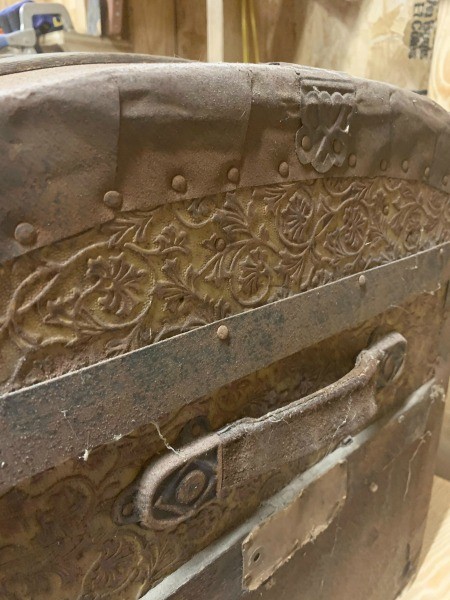 The side of an old trunk.