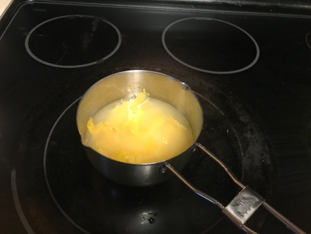Lemon simple syrup in a saucepan.