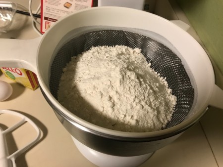 Sifting the cake mix.