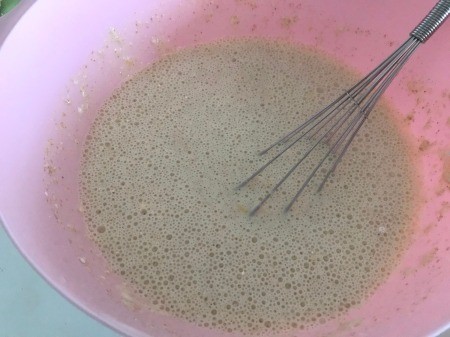 Mixing the pancake batter in a bowl.