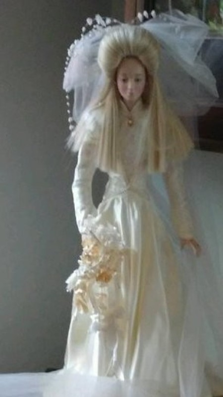 A porcelain bridal doll.