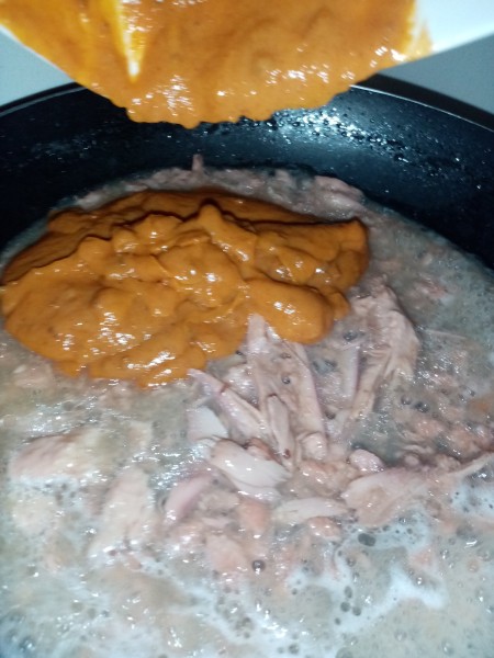 Adding ingredients to the pan.