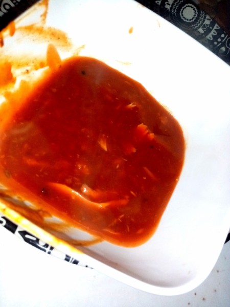 Adding sauce to a serving pan.