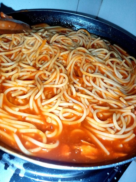 A pan of pasta and sauce.