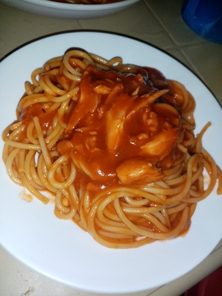 A plate of pasta and sauce.