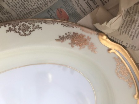 The edge of an ornate china platter.