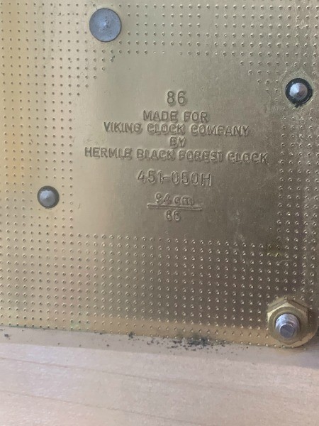 A marking on the back of a clock.