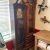 Two wooden grandfather clocks.