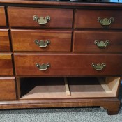 A dresser with the bottom drawer removed.