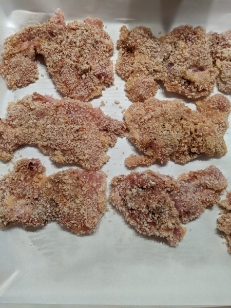 Breaded chicken ready for cooking.