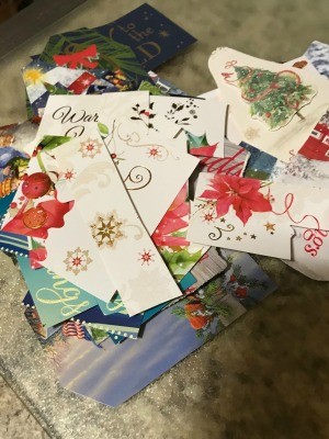 A pile of cut up Christmas cards