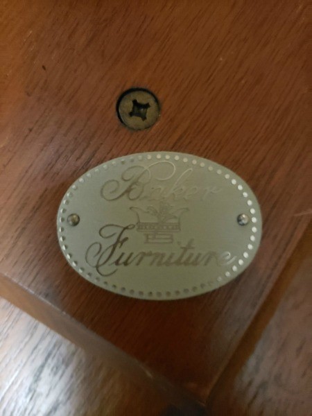 A manufacturing label on the bottom of a wooden table.