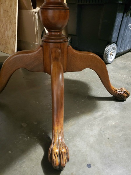 The legs of a wooden table.