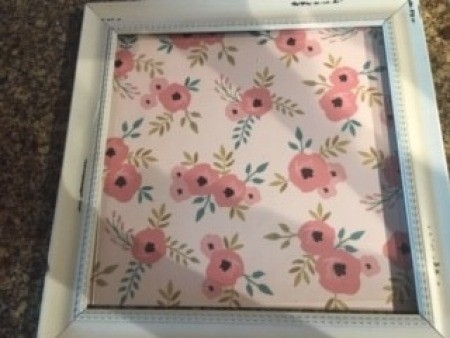 The frame filled with a piece of decorative paper.