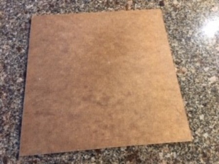 A square board before framing.