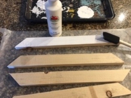 Painting the frame pieces before assembly.