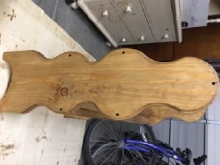 A side view of a quilt rack.