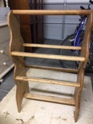 A completed wooden quilt rack.
