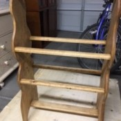 A completed wooden quilt rack.