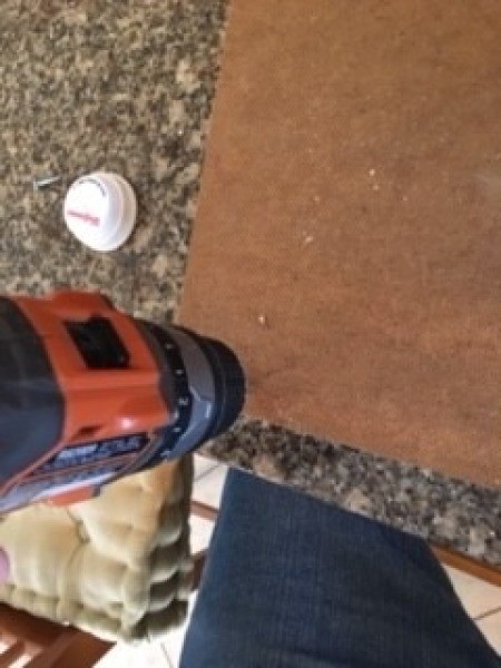 Drilling holes in the backing.