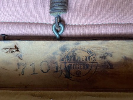 A marking on the underside of a chair.