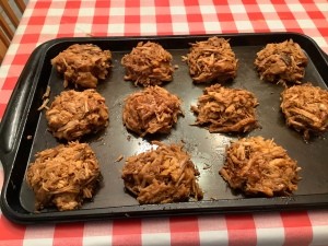 Individual serving of pulled pork on a cookie sheet.