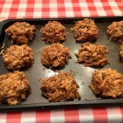 Individual serving of pulled pork on a cookie sheet.