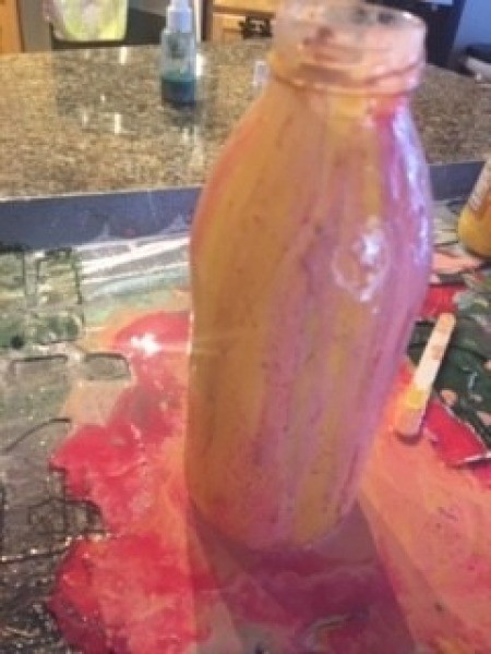 The paint covering the bottle.