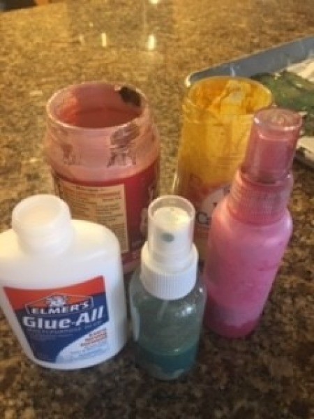Supplies for creating the painted bottle.