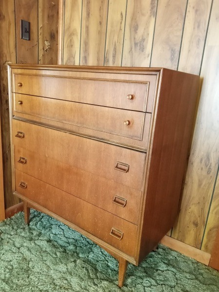 A taller dresser with 5 drawers.
