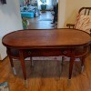 An oval wooden table.