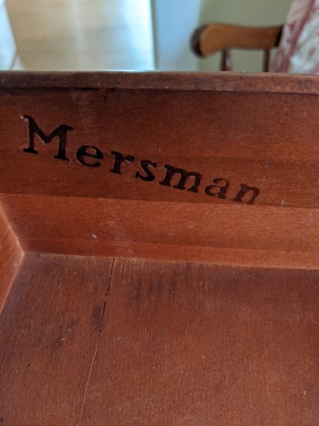 The Mersman marking on the underside of a table.