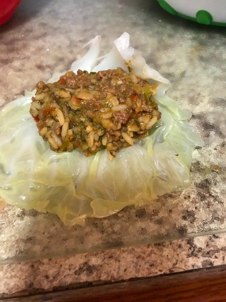 Filling the leaves with the stuffing mixture.