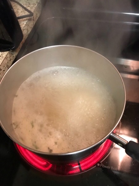 Cooking the pasta in a pan.