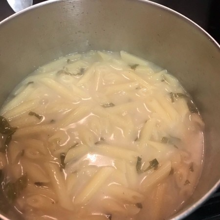 Cooking the lemon cream pasta sauce.